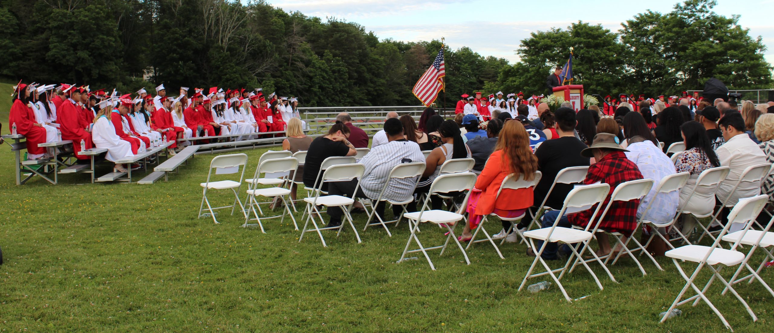 The audience watches the graduation ceremony