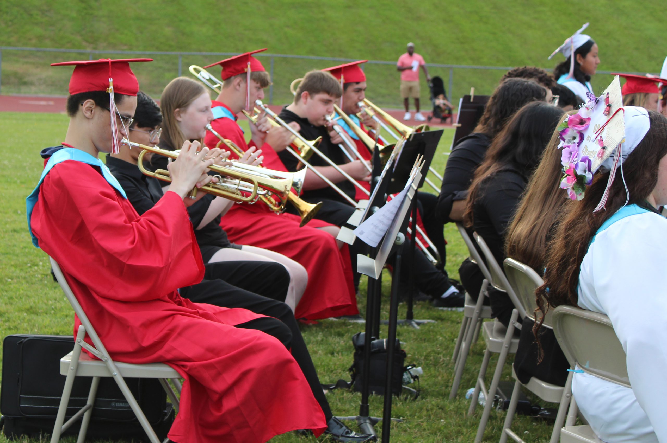 Graduates play brass instruments