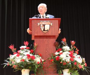 A man speaks at a podium